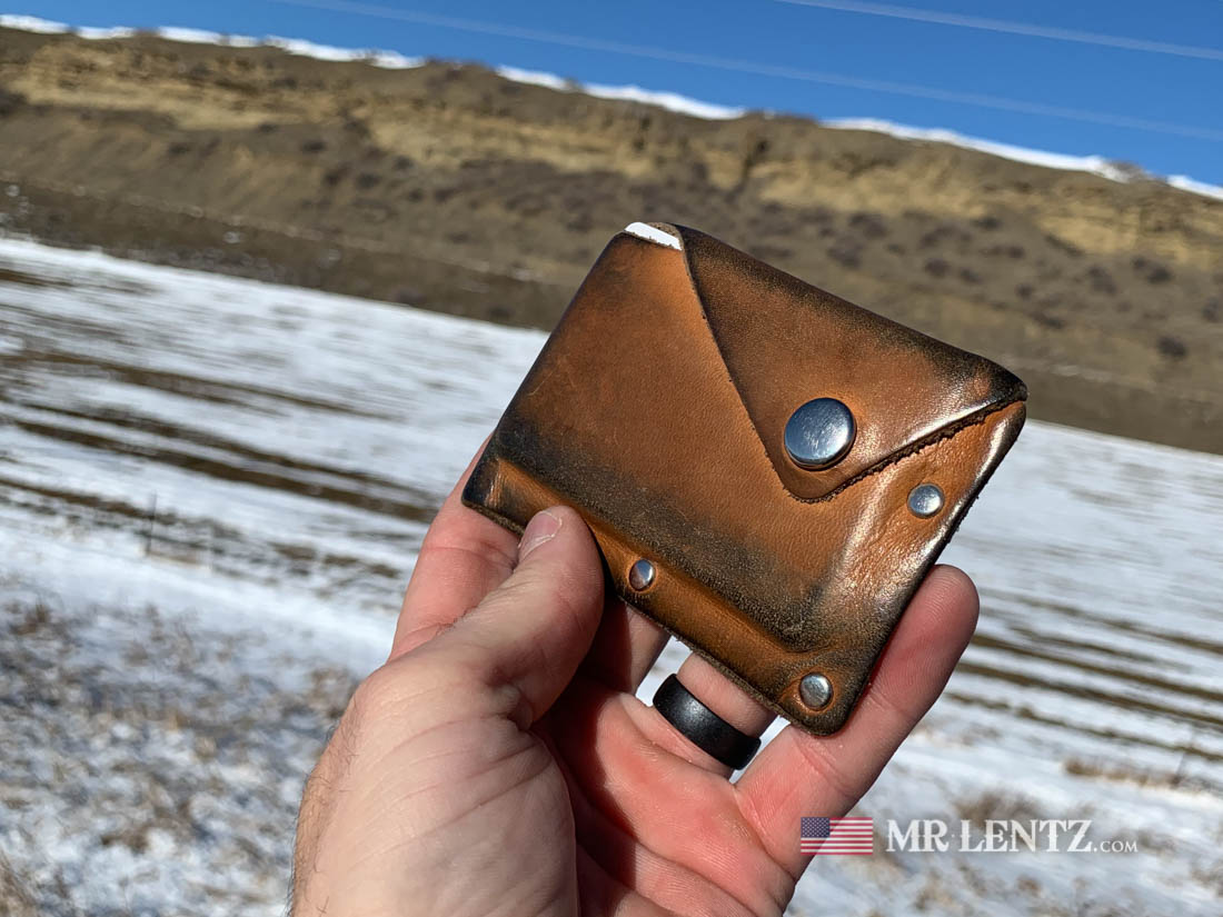 customer photo of snap wallet in aged tan