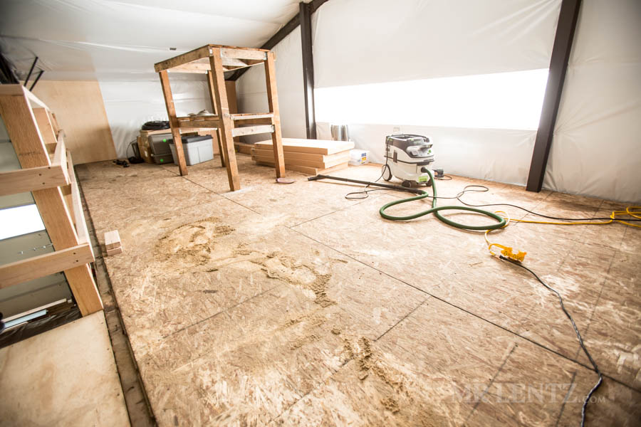 sanding wood floor in workshop building
