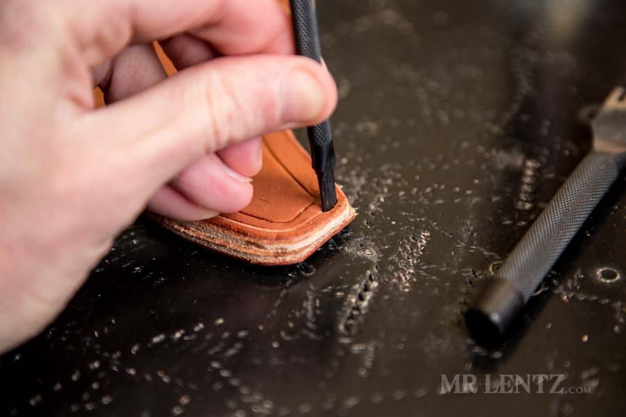 punching holes for axe sheath