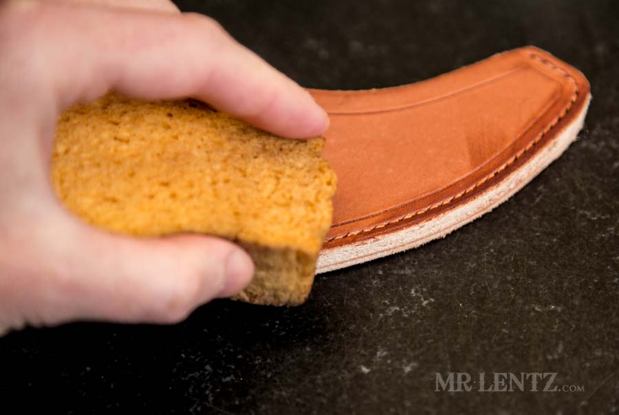 wetting the edge of the axe sheath