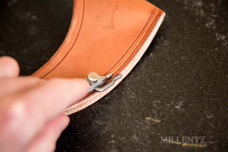 cutting the stitch groove on the backside of an axe sheath