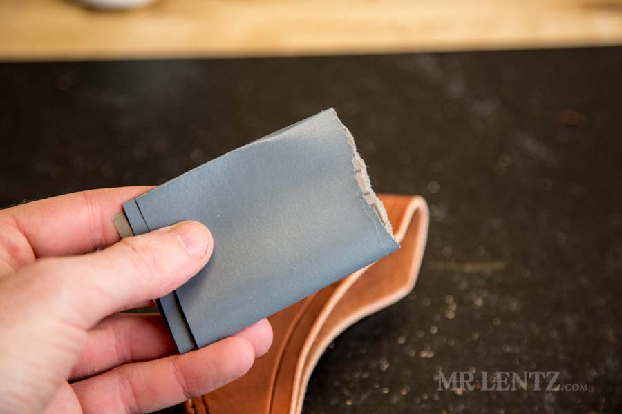 600 grit sandpaper used in sanding the edge of an axe sheath