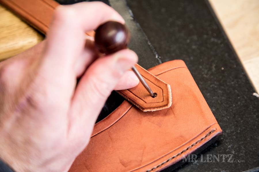 marking the placement of the retaining strap