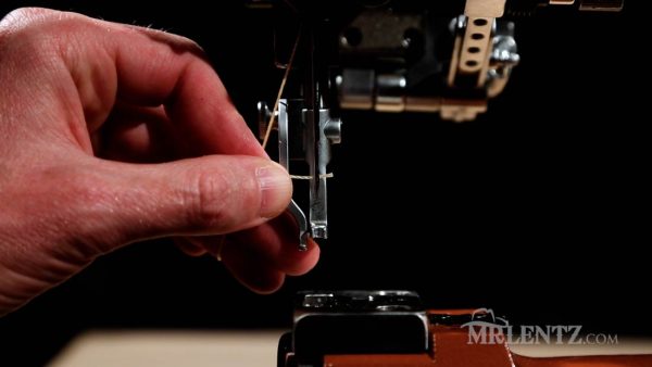 threading the needle on a heavy duty leather sewing machine
