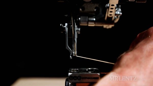 pulling thread through needle on leather sewing machine