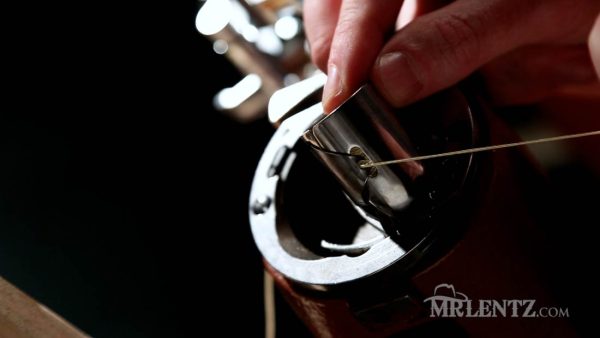 bobbin thread in tension spring on a leather sewing machine