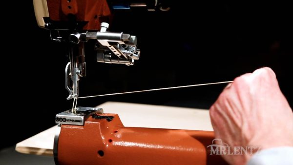 bobbin thread pulled up through bottom plate on leather sewing machine