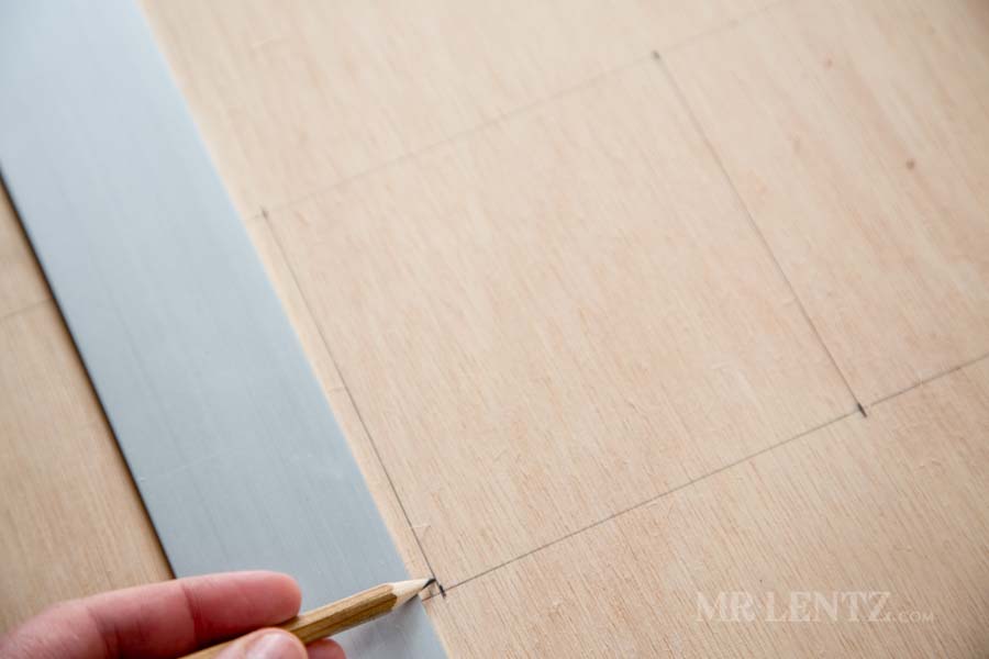 drawing out holes on plywood for electrical box