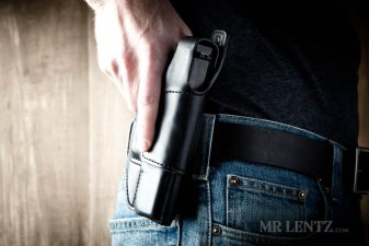combat grip on leather holster for glock handguns