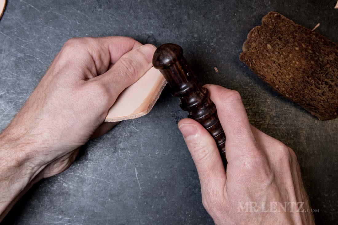 burnishing the edge of leather with a cocobolo tool