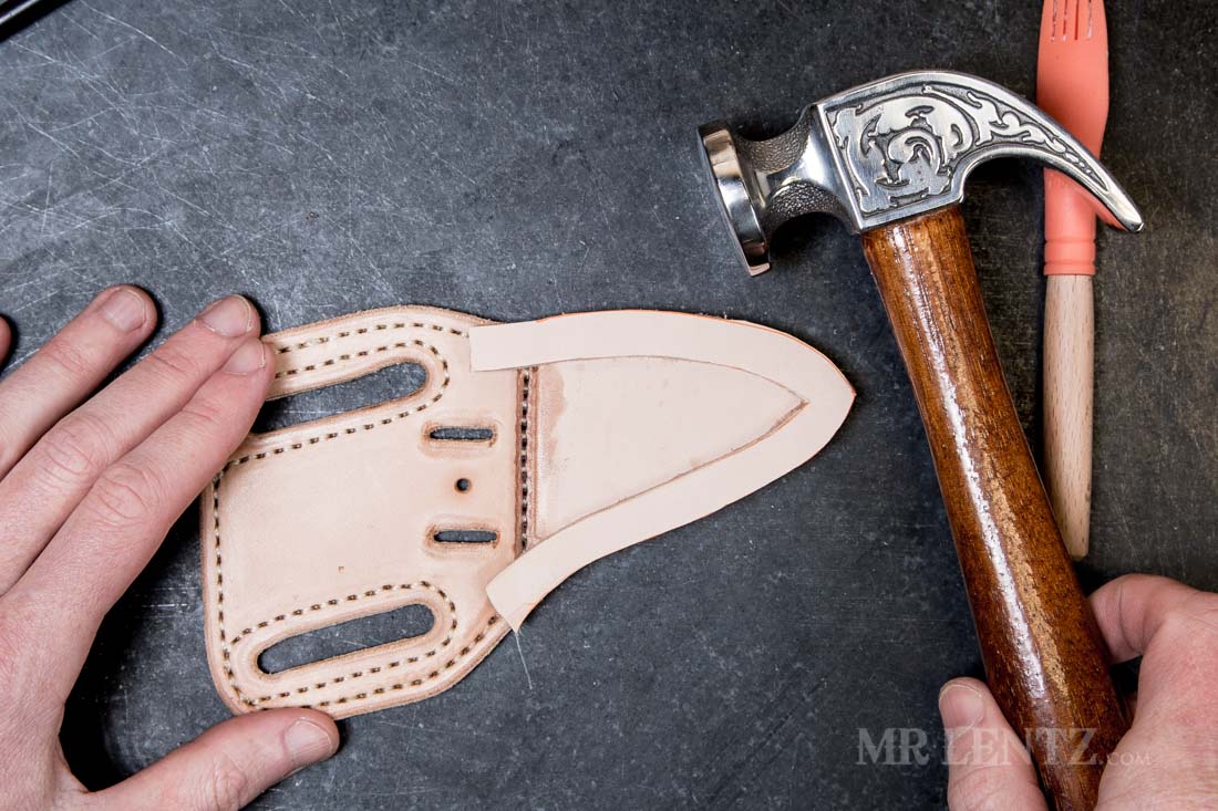 hammering the edge on a glued welt in a knife sheath