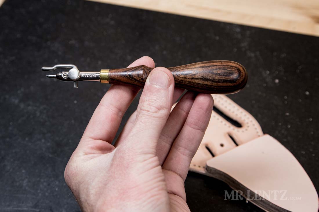 tool used to make a stitch groove in leather