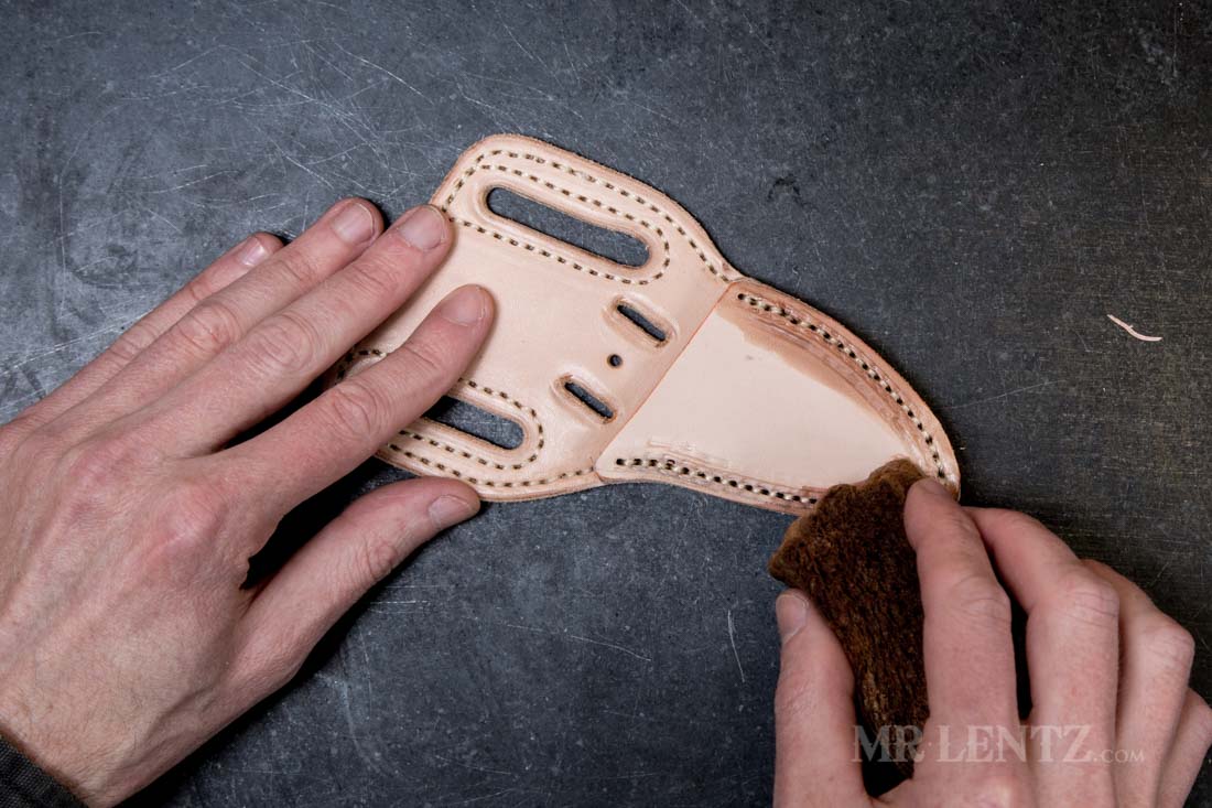 wetting the stitch line of knife sheath