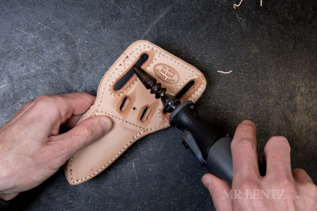 using dremel burnisher on belt slot holes of leather knife sheath