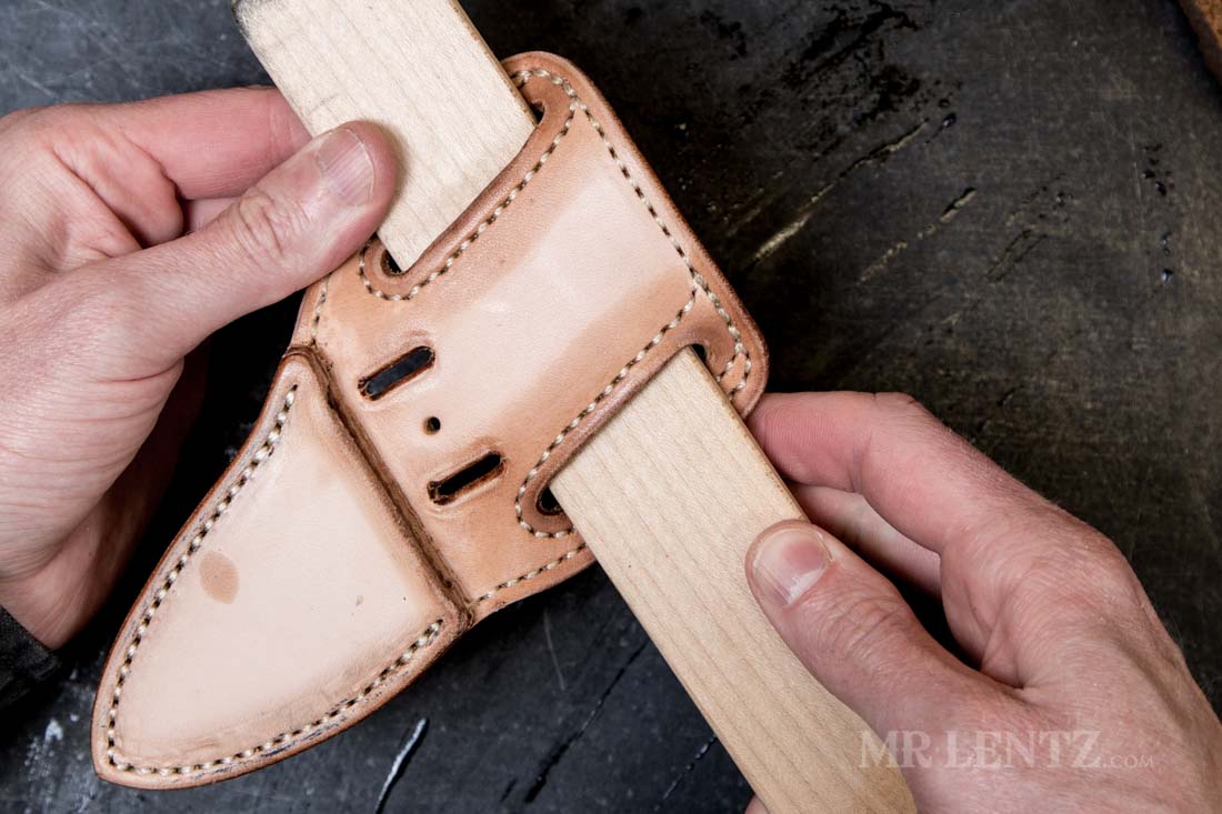 forming the belt holes on a leather sheath