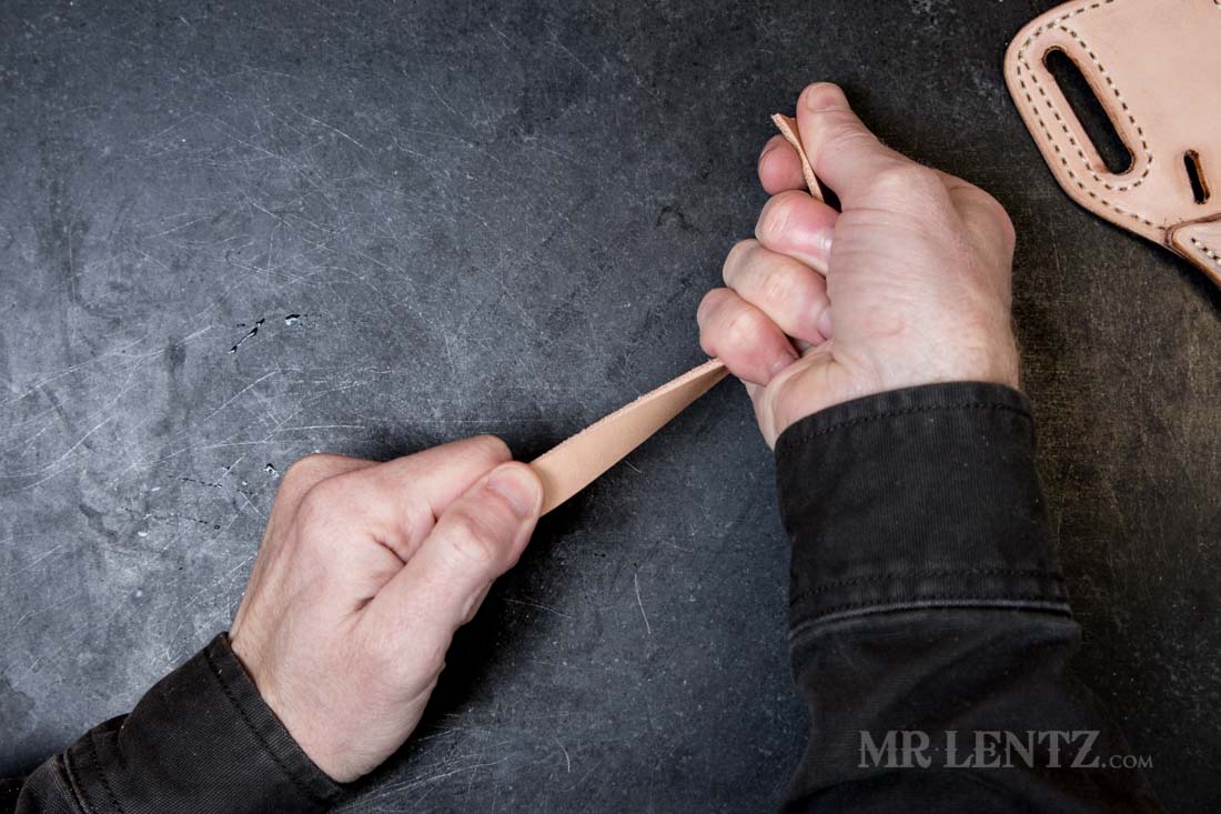 pre-stretching the retaining strap