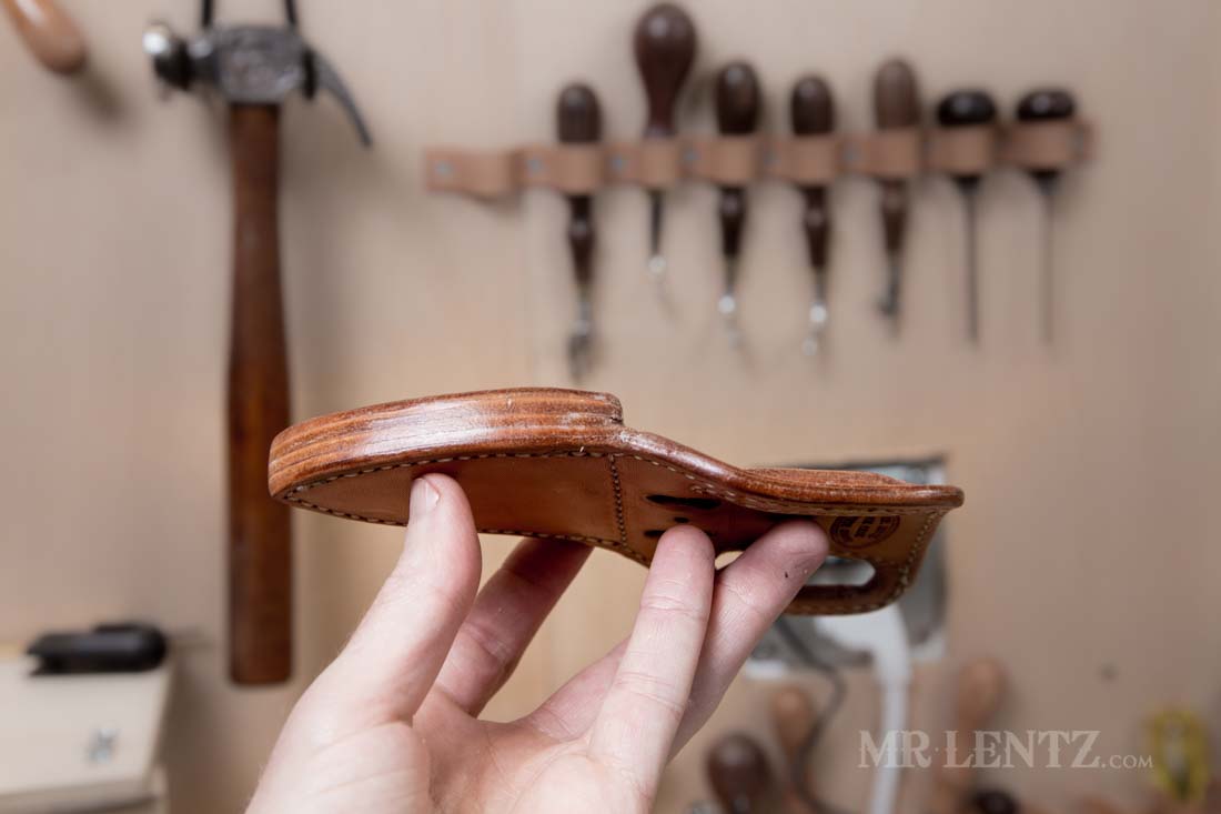 glossy polished edge of leather knife sheath